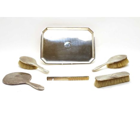 A George V silver dressing table tray, Syner &amp; Beddoes, Birmingham 1911, of canted rectangular outline, the engine turned