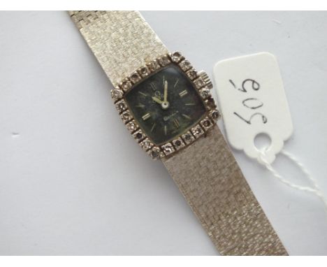 LADIES OMEGA GENEVE WRIST WATCH WITH DIAMOND SURROUND IN 18CT GOLD -(1 stone missing) WITH FLEXIBLE STRAP MARKED 42VI