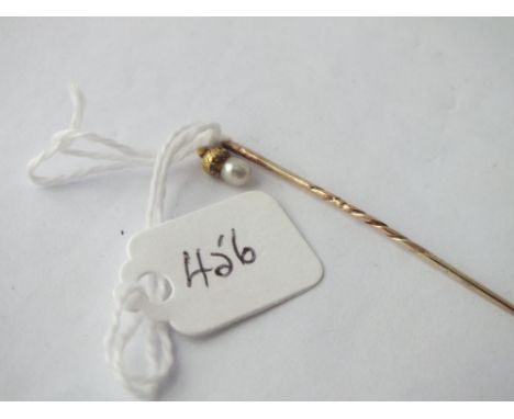 Gold stick pin set with pearl acorn