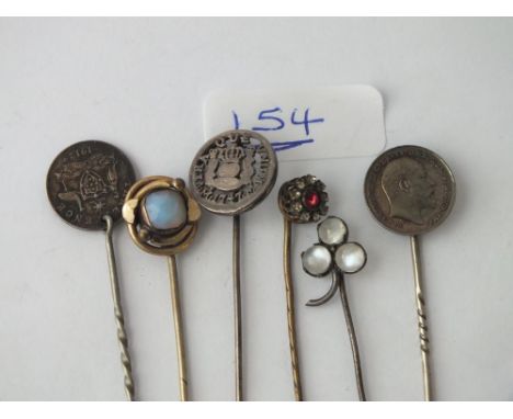Six assorted stick pins