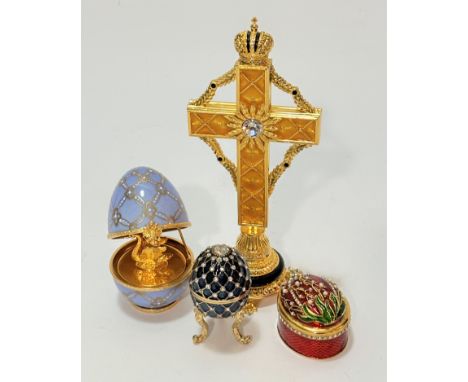 A Faberge style cross with mounted with Russian crown, with crystal set centre mounted on faux pearl circular base and paw fe