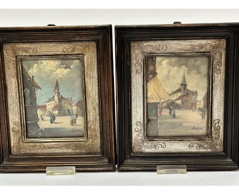 Dupred a pair of painted panels depicting town scenes with square and figures, in the 18thc style, in silver gilt mounted oak