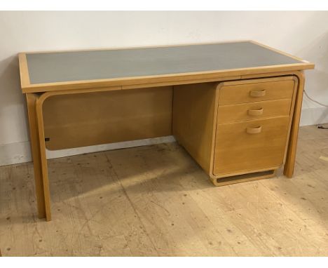 Magnus Olesen, a Danish light beech desk, the rectangular top with inset writing surface, over a separate unit with three dra