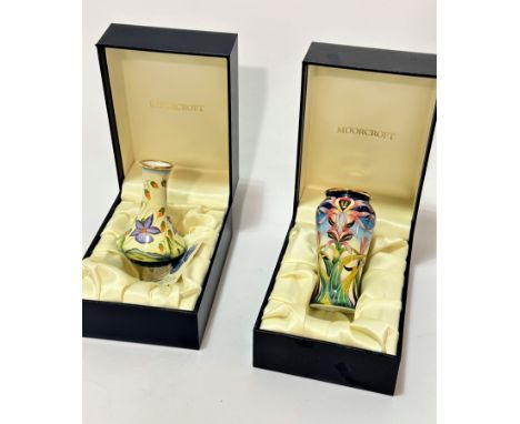A Moorcroft fine enamel painted on copper bottleneck baluster vase, decorated with floral sprays, complete with original box,