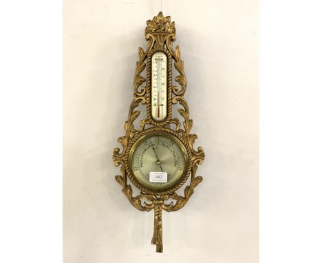 A 20th century gilt composition aneroid barometer and thermometer in the Rococo taste H54cm