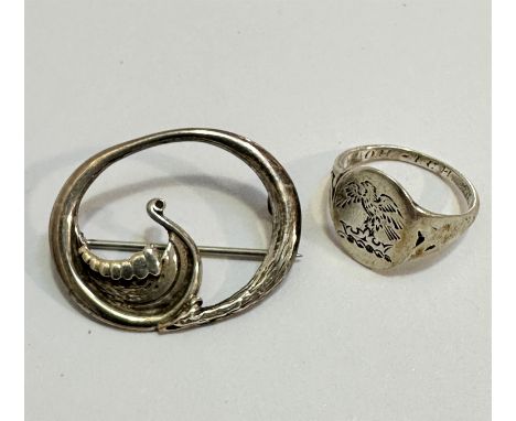 An oval Viking long boat open work brooch stamped verso Sterling Silver, makers mark OMG, and a silver Iona signet style ring