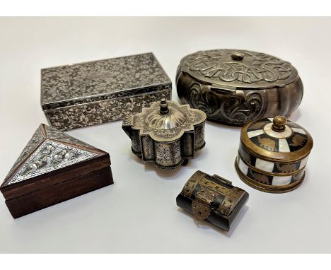 A collection of treen and metal boxes including a rectangular chased white metal box, (5cm x 6.5cm x 10cm), an oval Art Nouve