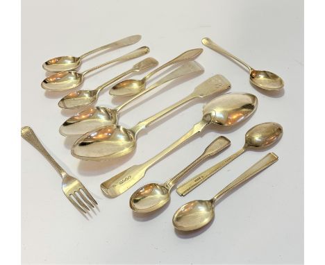 A London George III silver old English pattern spoon, a pair of Victorian fiddle pattern table spoons engraved with initial B