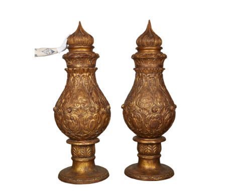 Pair of large carved and gilt wood decorative urns. Late 19th to early 20th century, likely French or Italian. Both feature e