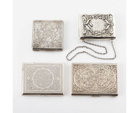 Group of four sterling silver cases, including a cigarette case and compact. Three small cases with engraved scrolling floral