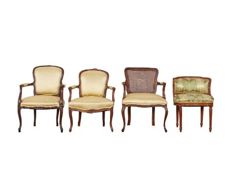 Group of French chairs, including three fauteuils, one with a caned back. With one low dressing table chair with green stripe