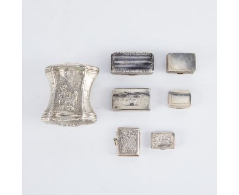 Group of seven small silver boxes, including snuff boxes and pill boxes. One double sided box, decorated in low relief with a