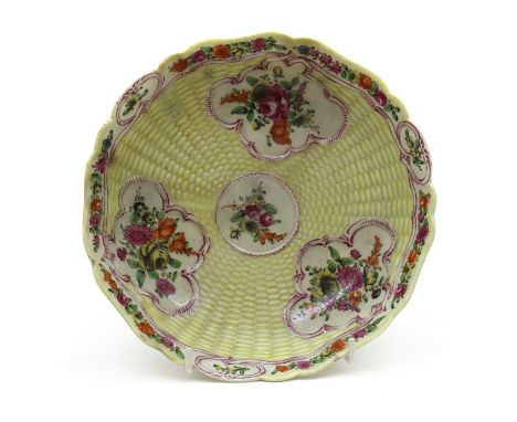 A Worcester porcelain junket dish, mid-18th century, decorated with three floral painted reserve around a further central res