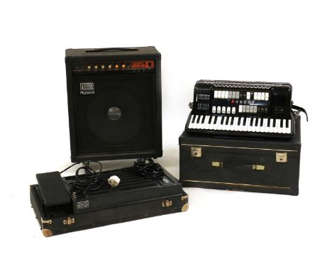 A Zero Sette Castlefidardo electric accordion,complete with a fitted case, a cased foot pedal and a Roland Spirit Bass 50 (3)