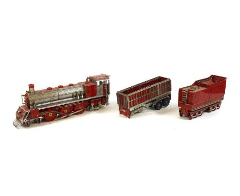 A scratch-built Meccano steam locomotive,102cm longwith a tender and a trailereach 67cm longCondition ReportSome bolts may be