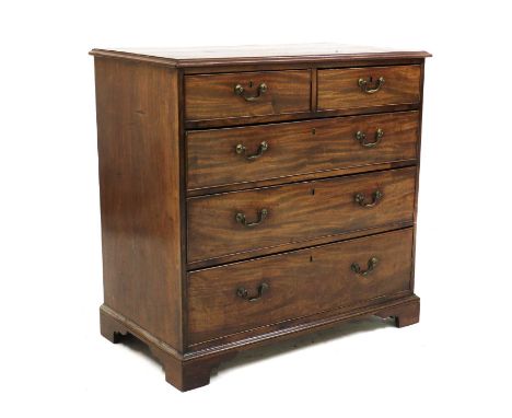 A George III mahogany chest of drawers,the moulded rectangular top above two short and three long drawers, raised on bracket 