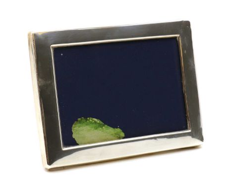 A silver photograph frame,by D R &amp; S, Sheffield 1983, of plain rectangular form,16cm x 12cmCondition ReportDents to to th