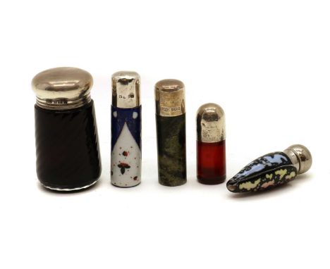 A collection of silver topped scent bottles,late 18th to early 29th century, comprising a moulded purple glass example, 7.5cm