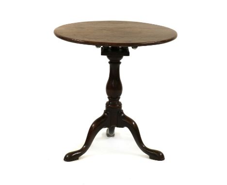 A George II mahogany tripod table,with a birdcage mechanism, raised on a turned baluster column, Cook of Marlborough label68c