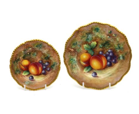 A Royal Worcester porcelain fallen fruits tea plate,20th century, by J.Cook, painted with plums and grapes within a gilt bord