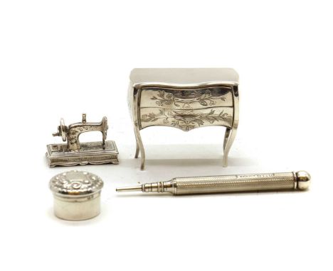 A cased silver novelty commode,by Holme Rayson, London 1979, floral engraved, with two pull-out drawers, 5.5cm wide5cm highto