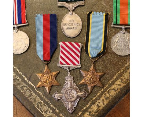 A WWII AFC medal group awarded to Squadron Leader Brian H. Moloney,comprising an Air Force Cross, an Air Efficiency Award, Th