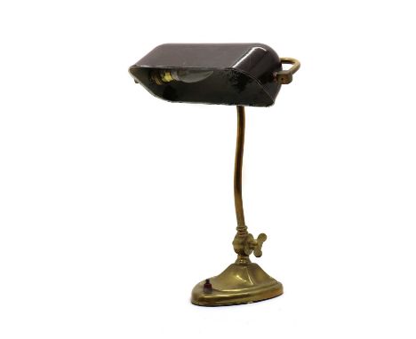 A table lamp,1920s - 30s, with a brown bakelite shade, on a brass base,39cm highCondition ReportDents to one edge of the base