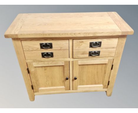 A contemporary light oak sideboard fitted with four drawers, width 100 cm 