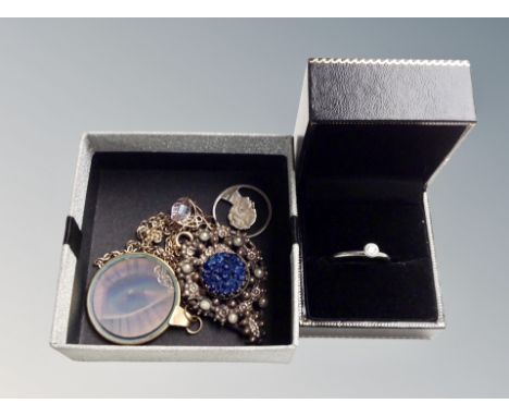 A box of Scottish cape clip, yellow metal 22k gold plate eye hologram necklace, silver virtue ring 