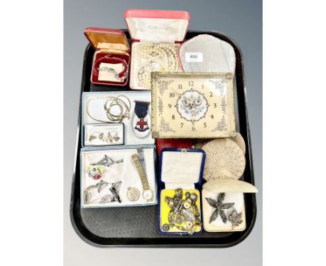 A tray of costume jewellery, pearls, compact, silver marcasite pieces, hand mirror, desk timepiece etc