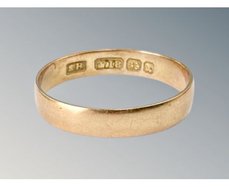 An 18ct gold band ring, size P CONDITION REPORT: 2g