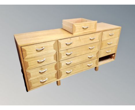 A light beech multi drawer low sideboard, width 165 cm 