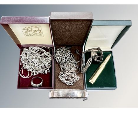 A group of silver and white metal necklaces, chains, ring, silver bangle etc, together with lighter the form of a bullet. (Q)