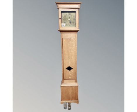 A 19th century oak longcase clock with brass dial, pendulum, weights and key 