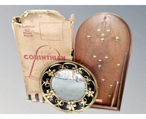 A gilt framed porthole mirror and a bagatelle board 