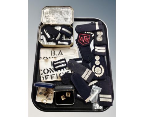 A tray of police and fire service epaulettes, cuff links etc 