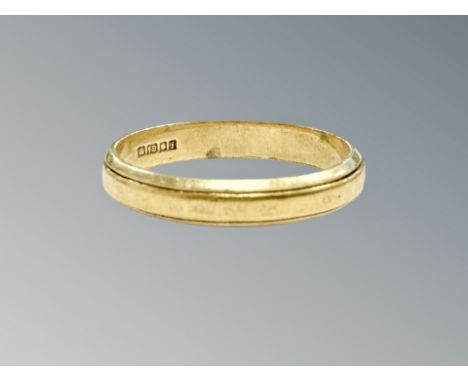 An 18ct gold band ring, size N CONDITION REPORT: 2.8g