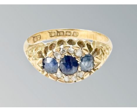 An 18ct gold sapphire and diamond ring, size L CONDITION REPORT: 3.5g