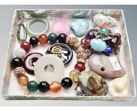 A small tray of polished stone polar bear, jade ring, polished stone pendant, earrings, brooch etc 