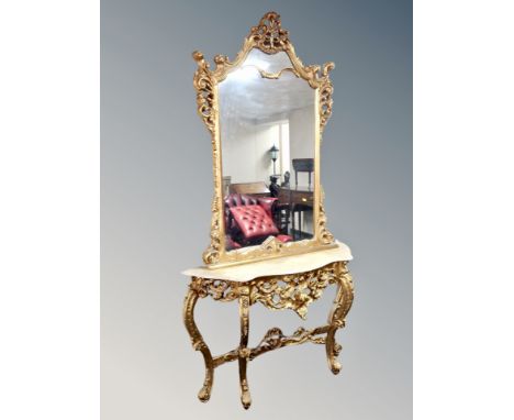 An ornate reproduction gilded two-piece console table with mirror, table width 130 cm, mirror 100 cm x 150 cm, with faux marb