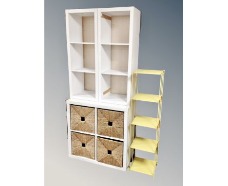 A pair of white cube shelves together with a white cube four drawer shelf and metal four tier stand 