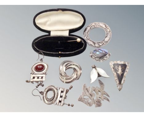 A group of silver jewellery including Celtic brooch, abalone brooch, Norwegian enamelled silver brooch by David Andersen, pea