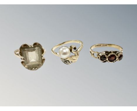 A 9ct gold garnet ring, similar quartz ring and a 14ct gold pearl ring. (3) CONDITION REPORT: 9ct rings 5.3g gross. 14ct gold