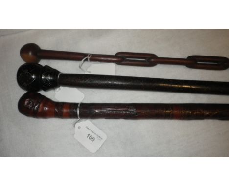 A JAPANESE CARVED WOODEN WALKING STICK and two others similar