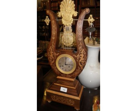 A 19TH CENTURY LYRE MANTEL CLOCK, the silvered dial inscribed 'Hry Marc, Paris' with a marquetry inlaid rosewood case and nov