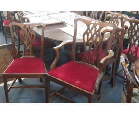 A SET OF TWELVE MAHOGANY CHIPPENDALE DINING CHAIRS with pierced splats to include two carvers