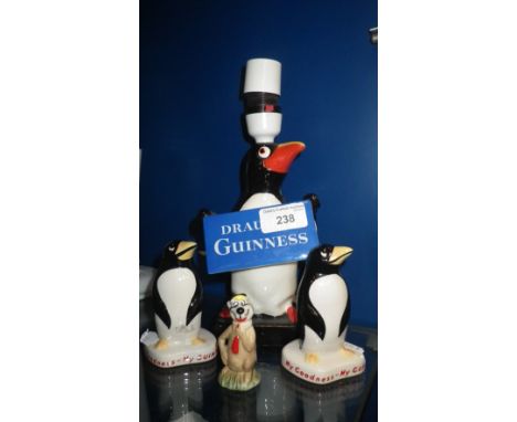 A CARLTON WARE 'DRAUGHT GUINNESS' PENGUIN TABLE LAMP and three similar ornaments