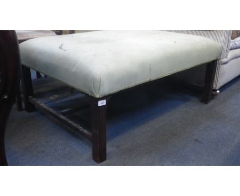 A GEORGE II STYLE UPHOLSTERED STOOL on square legs 28" x 39" 