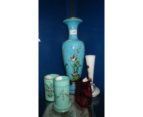 A VICTORIAN BLUE GLASS VASE, painted with a bird amongst flowers and other similar glass