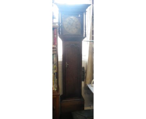 AN OAK LONGCASE CLOCK, THE BRASS DIAL SIGNED "W BURTON KENDAL" with a 30 hour movement striking on a bell 79.5" high